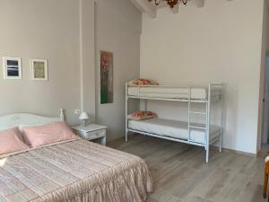 Postel nebo postele na pokoji v ubytování B&B Nonna Teresa
