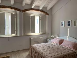 Postel nebo postele na pokoji v ubytování B&B Nonna Teresa