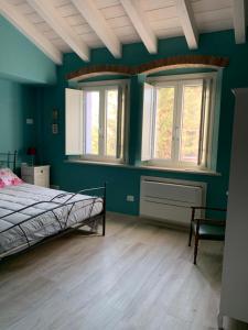Postel nebo postele na pokoji v ubytování B&B Nonna Teresa