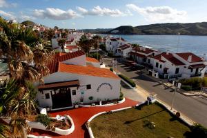 an aerial view of a town next to the water at Apartamentos El Bergantin Menorca Club in Fornells