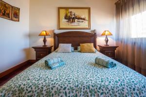 a bedroom with a bed with two pillows on it at Apartamento Portas do Mar I in Matosinhos