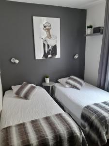 מיטה או מיטות בחדר ב-A Mi Chemin