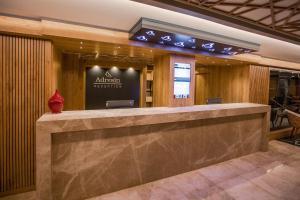 a lobby of a hotel with a reception desk at Adresin Hotel in Edirne