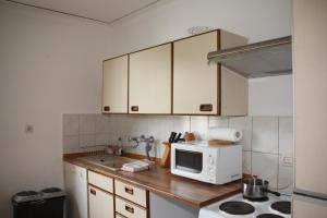 Kuchyň nebo kuchyňský kout v ubytování Abels Appartements + 16 fotografií