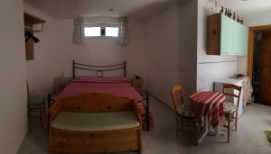 Ein Bett oder Betten in einem Zimmer der Unterkunft La casa sui trulli