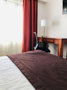Säng eller sängar i ett rum på Hotel Terrasur