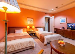 Postel nebo postele na pokoji v ubytování A-BRAND HOTEL