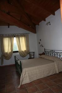 Llit o llits en una habitació de AGRITURISMO Costa Verde
