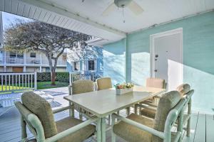 a dining room with a table and chairs at Steps to Daytona Beach Updated Home with Deck! in Daytona Beach