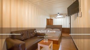Un televizor și/sau centru de divertisment la Tuscany Land Resort Donmuang