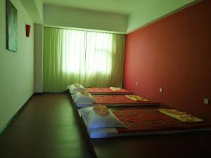 PACI Hotel&SPA客房内的一张或多张床位