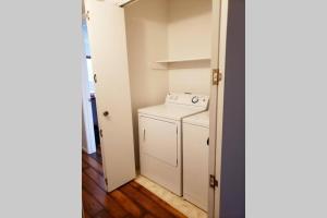 a small laundry room with a washer and dryer at Pebble Creek in Three Rivers