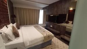 Postel nebo postele na pokoji v ubytování Regenta Central Hotel & Convention Centre Nagpur + 37 fotografií