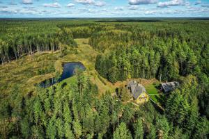 an aerial view of a house in the middle of a forest at Bergervilla Boutique Guest House & SPA in Mežmuiža
