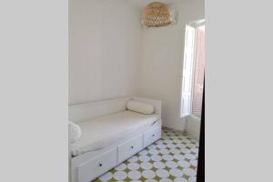 A bed or beds in a room at Villa Bianca, Seaside panoramic Rooftop