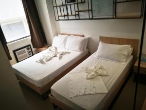 Postel nebo postele na pokoji v ubytování Hotel Rupert A Baler