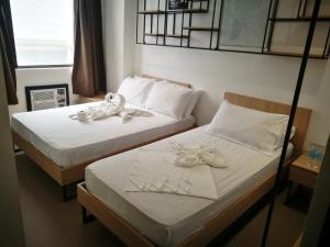 Postel nebo postele na pokoji v ubytování Hotel Rupert A Baler