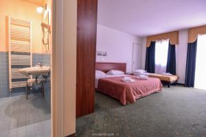 Postel nebo postele na pokoji v ubytování Standard Hotel Udine + 34 fotografií