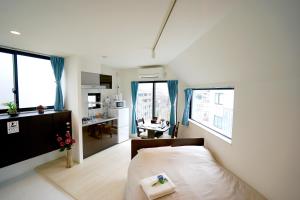 เตียงในห้องที่ Court Residence Tokyo Nakano