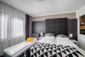 Postel nebo postele na pokoji v ubytování Eisberg Hotel Schwanen