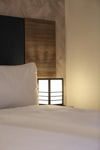 Katil atau katil-katil dalam bilik di Hotel Spatz