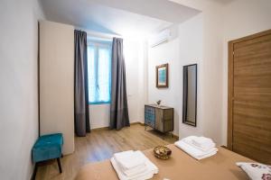 Postel nebo postele na pokoji v ubytování Valle dei Mulini - Apartment