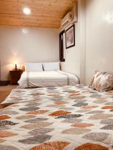 Postel nebo postele na pokoji v ubytování Grace House Homestay 2