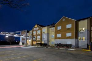 a rendering of a hotel at night at La Quinta by Wyndham Emporia in Emporia