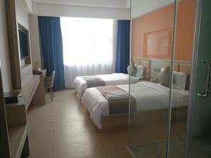 PACI Hotel&SPA客房内的一张或多张床位