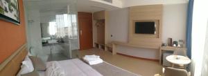 PACI Hotel&SPA客房内的一张或多张床位