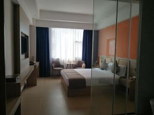 PACI Hotel&SPA客房内的一张或多张床位