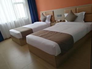 PACI Hotel&SPA客房内的一张或多张床位