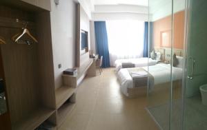 PACI Hotel&SPA客房内的一张或多张床位