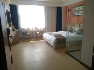 PACI Hotel&SPA客房内的一张或多张床位