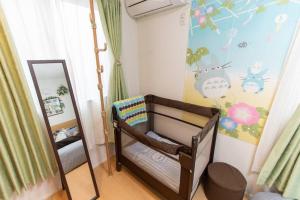 Una cama o camas en una habitación de CuteFamilyHouse! 3LDK 6minShinjuku 3minJRsta Cozy,Fun,Bright! KidsFree Under6yrs