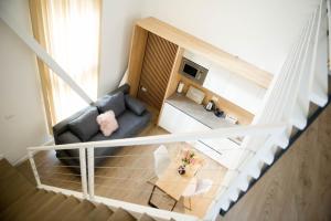 an overhead view of a living room with a couch and a table at FRIENDS RESIDENCE Apartments in Timişoara