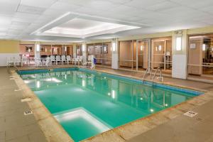 a large swimming pool in a hotel room at Comfort Suites Oakbrook Terrace near Oakbrook Center in Oakbrook Terrace