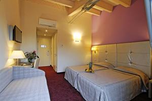 Postel nebo postele na pokoji v ubytování Boutique Hotel Calzavecchio