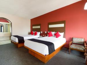 Säng eller sängar i ett rum på Hotel La Fuente, Saltillo