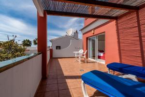 a balcony with a view of the ocean at Los Arcos in Nerja