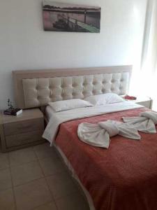 Ένα ή περισσότερα κρεβάτια σε δωμάτιο στο Knossos Apartments