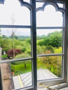 a window with a view of a road at Lydford House in Lydford
