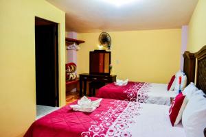 Postel nebo postele na pokoji v ubytování HOTEL EDELMIRA