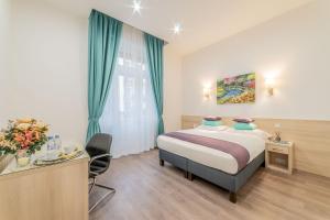 Posteľ alebo postele v izbe v ubytovaní Global Suites Budapest