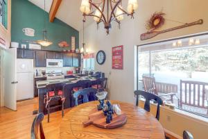 a kitchen and dining room with a table and chairs at Pines 4048 in Pagosa Springs
