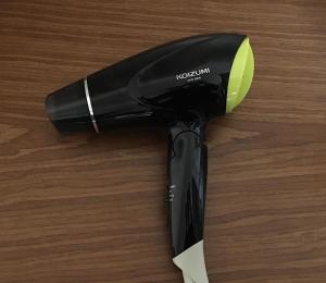 a hair dryer sitting on top of a wooden table at Coco Fukuoka Chiyo in Fukuoka
