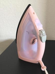 a pink toilet with a toothbrush in it at Coco Fukuoka Chiyo in Fukuoka