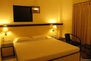 Postel nebo postele na pokoji v ubytování Hotel Salem Regency - A Business Stay