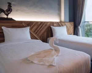 Postel nebo postele na pokoji v ubytování OU HOTEL