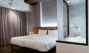 Postel nebo postele na pokoji v ubytování OU HOTEL